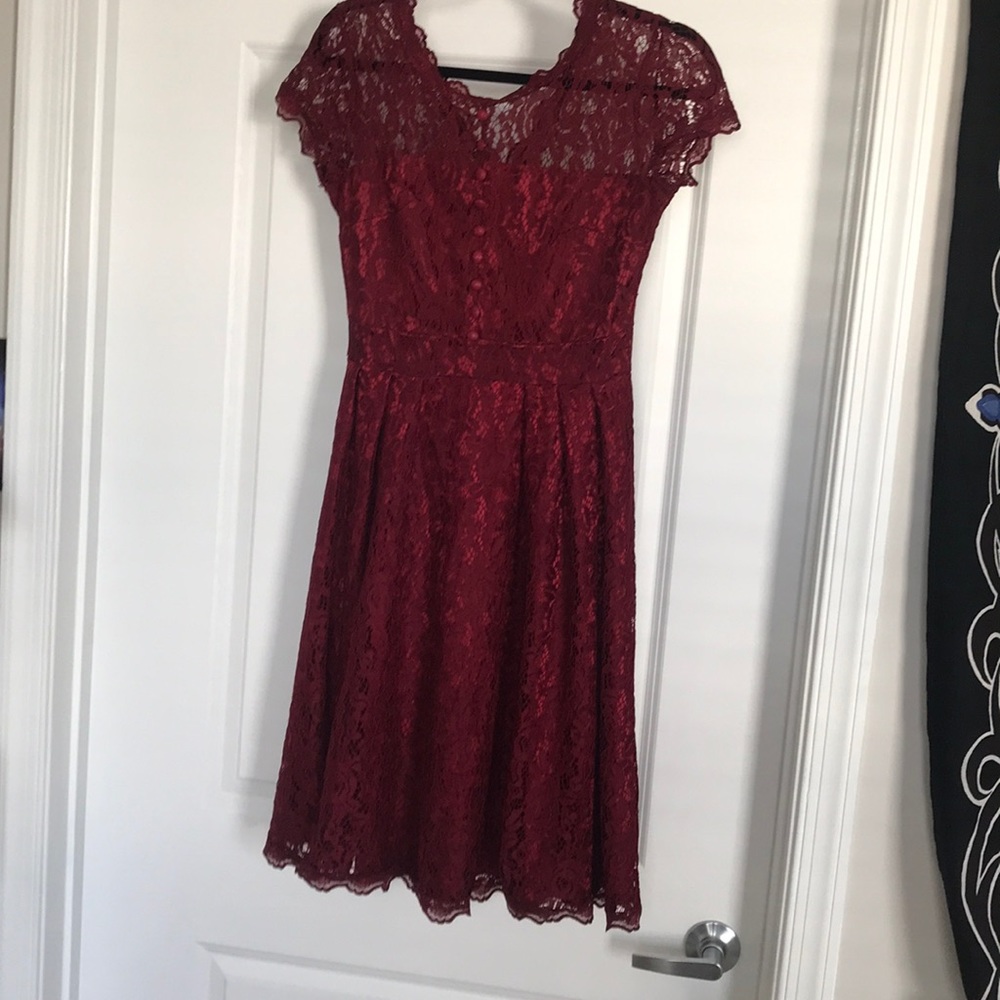 Medium length red lace dress